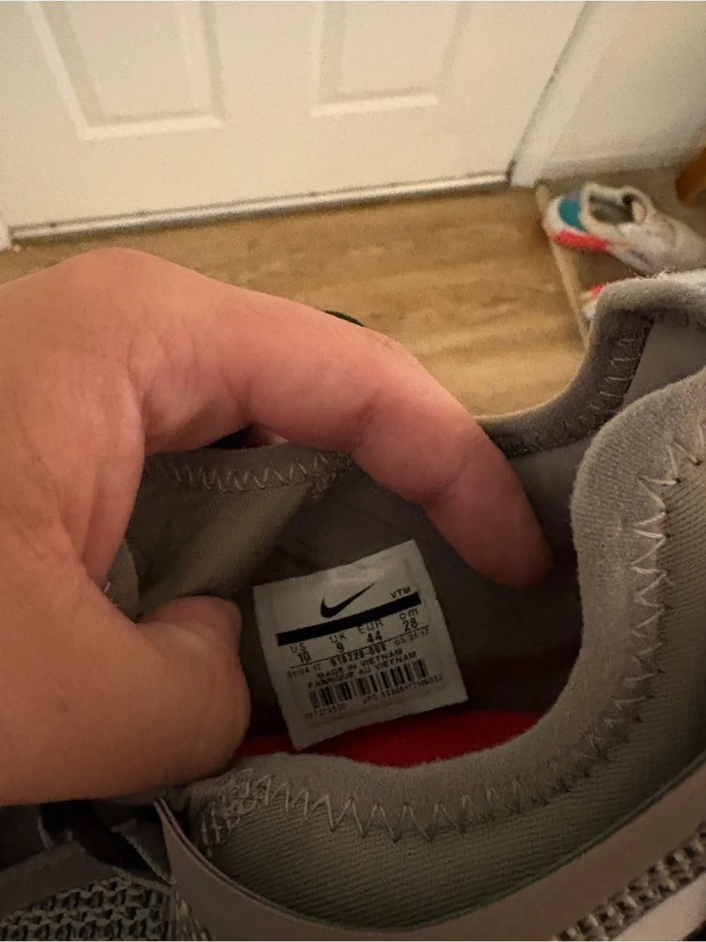 Nike Gray Mesh Running Shoes with White Swoosh and Red Interior